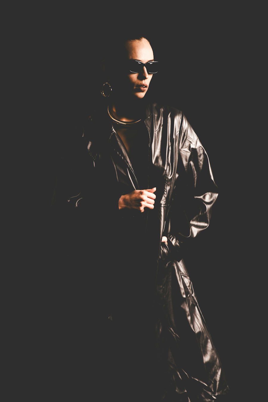 Person in a leather jacket and sunglasses
